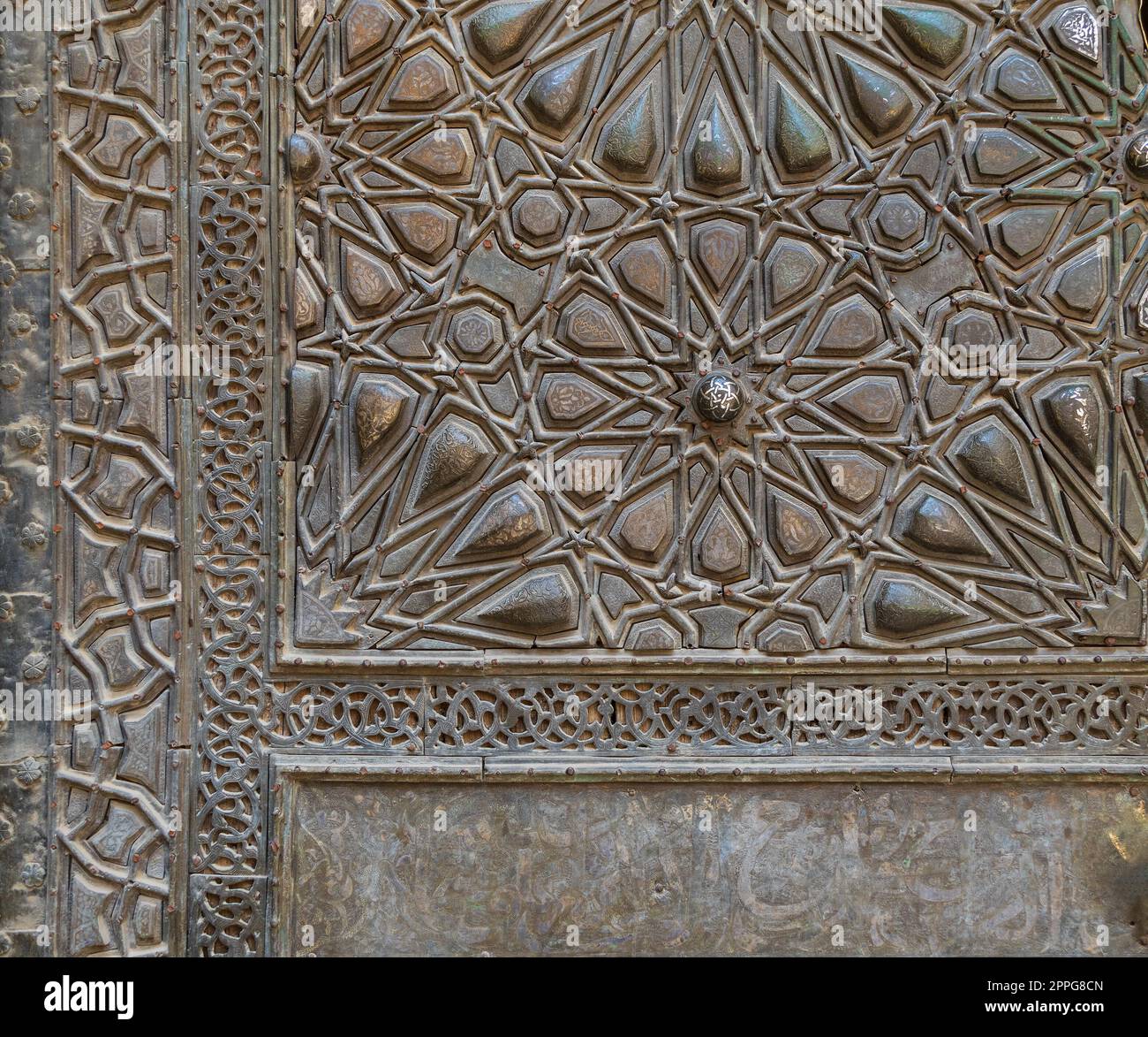 Ornaments of the bronze plate door of ancient historic mosque of Sultan Basque, Cairo, Egypt Stock Photo