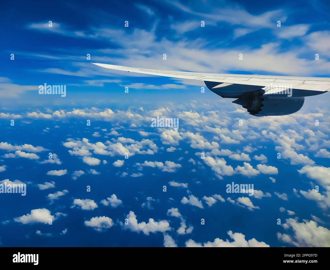 View from an airplane on a blue sky and white clouds Stock Photo - Alamy