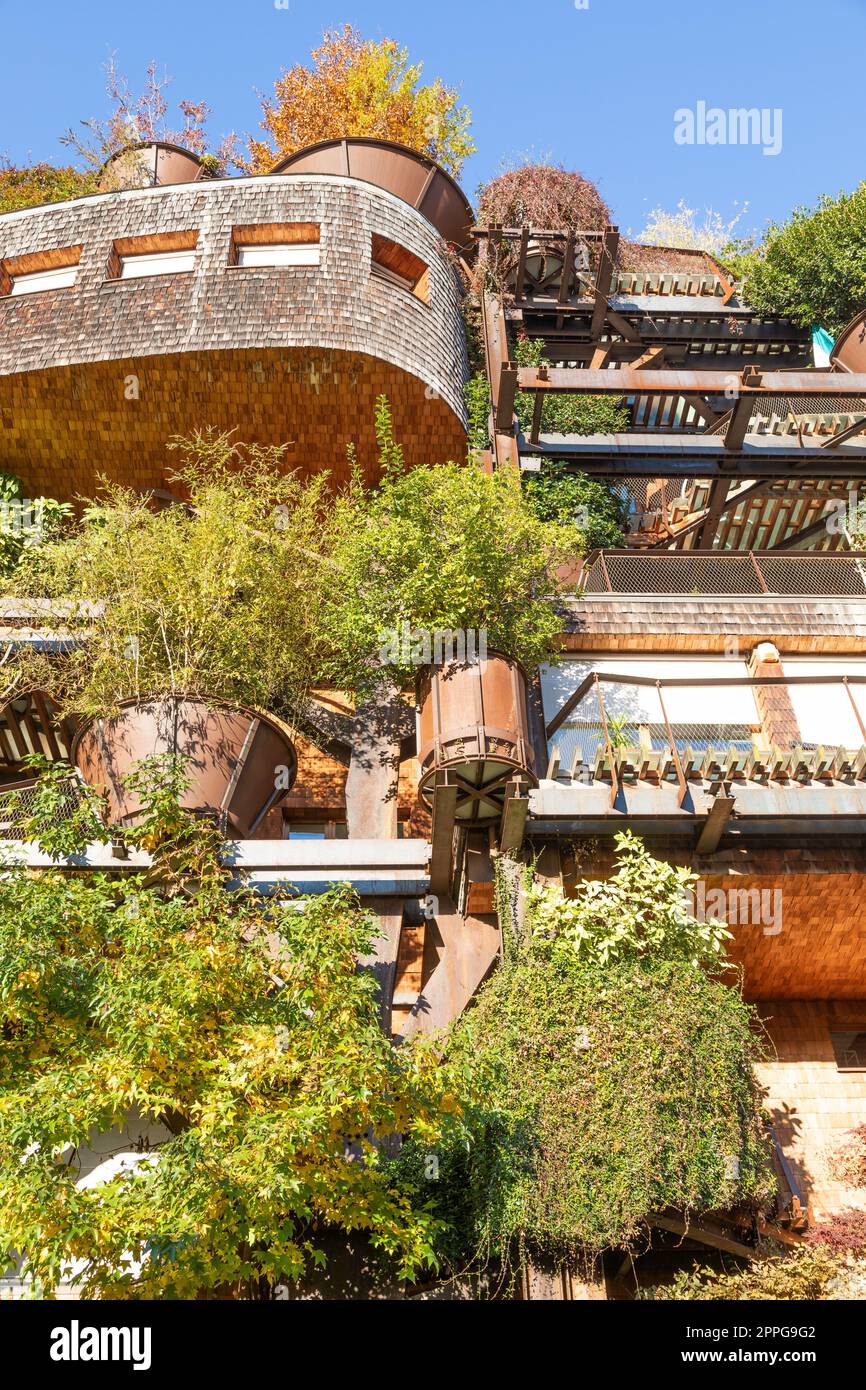 Real estate green residential building in Turin, Italy. Exterior with modern design, plants and wood integrated. Stock Photo