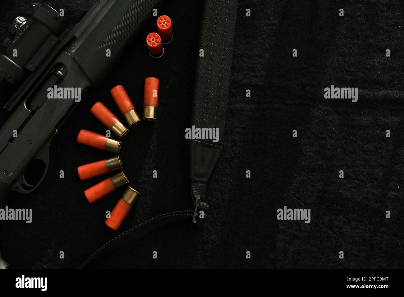 Weapon on black cloth: rifle, shells,top view. Top view of rifle ...