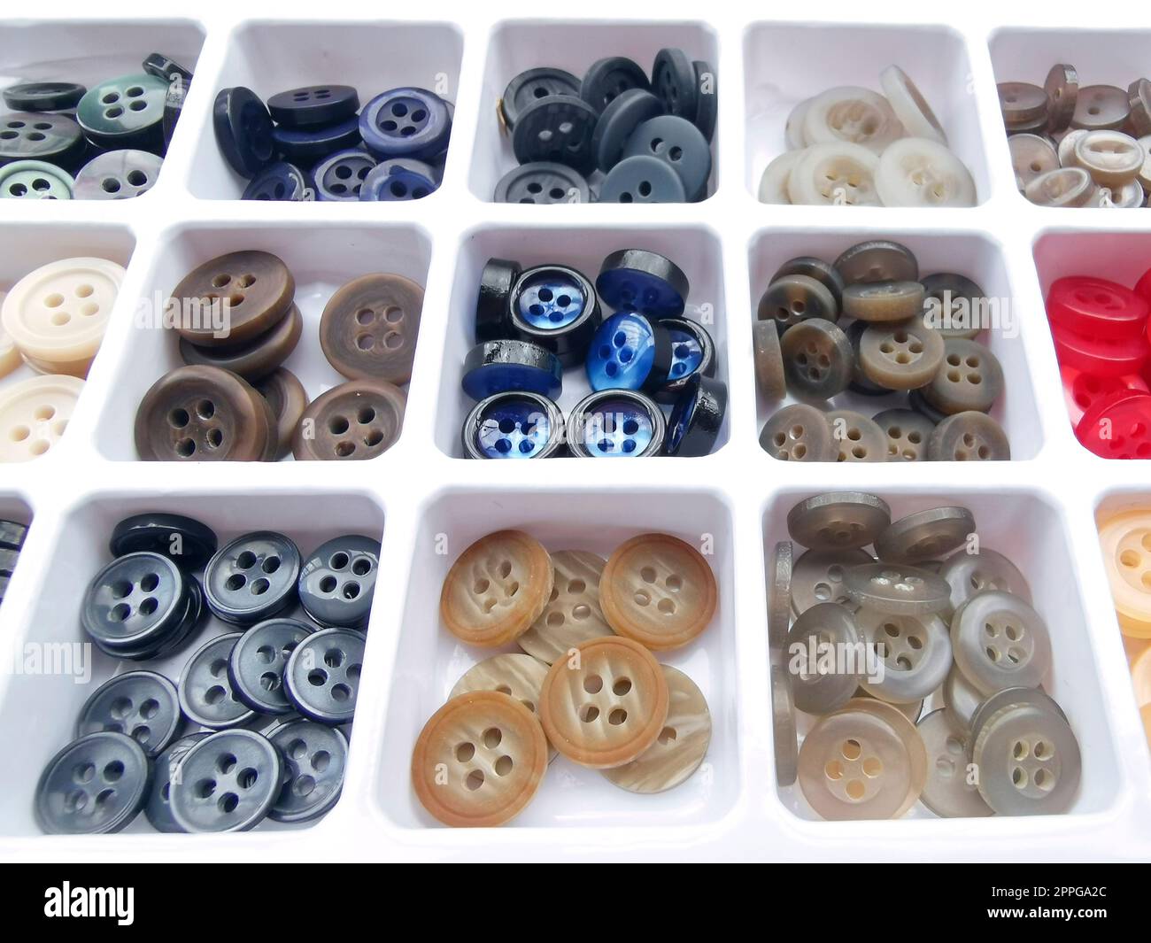 colorful buttons for handicrafts in box isolated on white Stock Photo