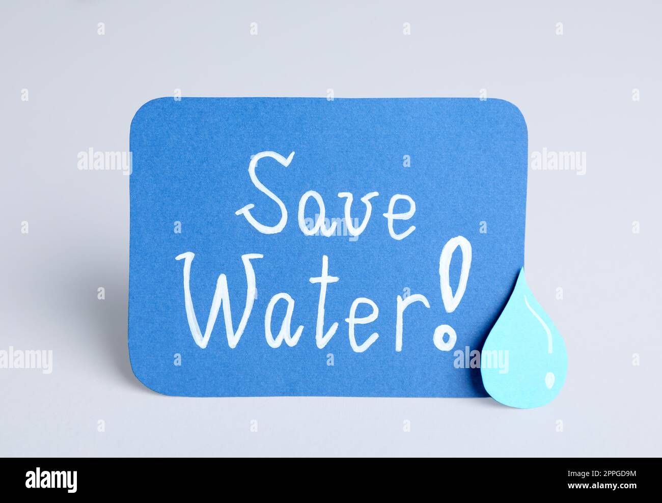 Card with words Save Water and paper drop on light grey background