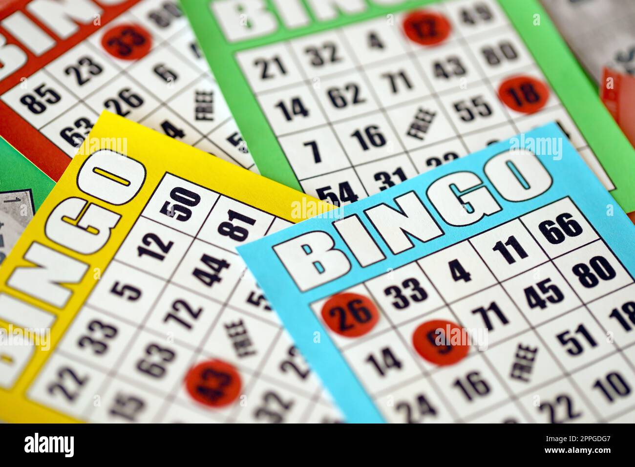 Many colorful bingo boards or playing cards for winning chips. Classic