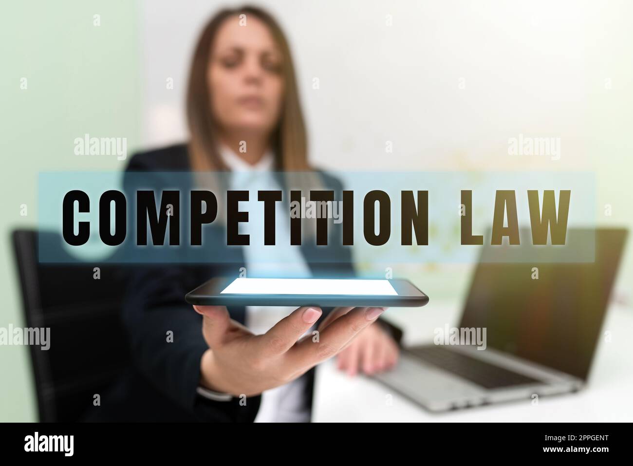 Hand writing sign Competition Law. Internet Concept regulating the monopoly and unfair business practices Stock Photo