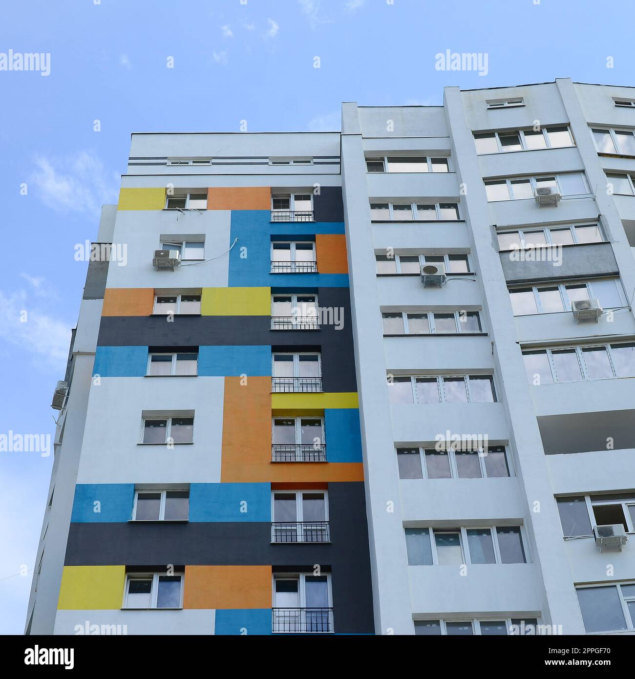 New multy storey residential building and blue sky Stock Photo - Alamy