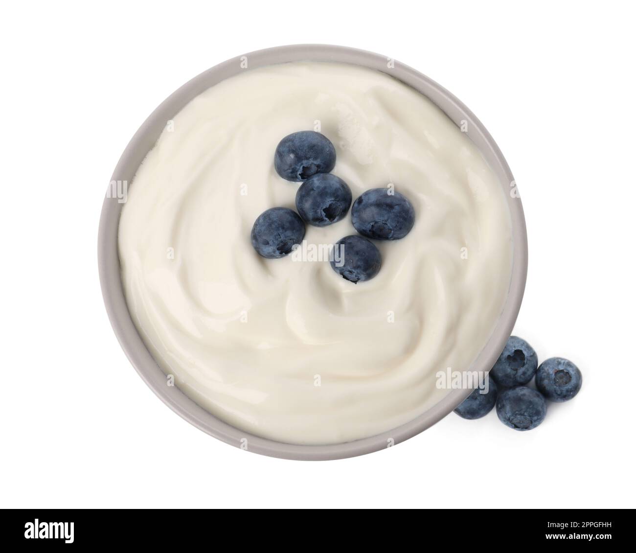 Bowl of delicious yogurt with blueberries on white background, top view Stock Photo