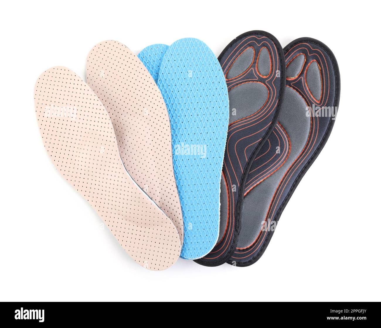 Pairs of different insoles on white background, top view Stock Photo ...