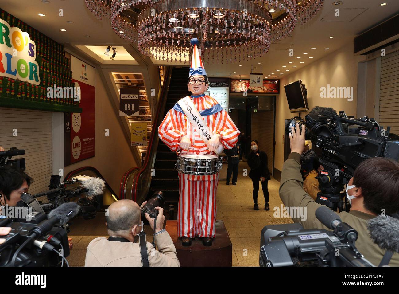 Kuidaore Taro, a mechanical drum-playing clown receives a drum made by ...