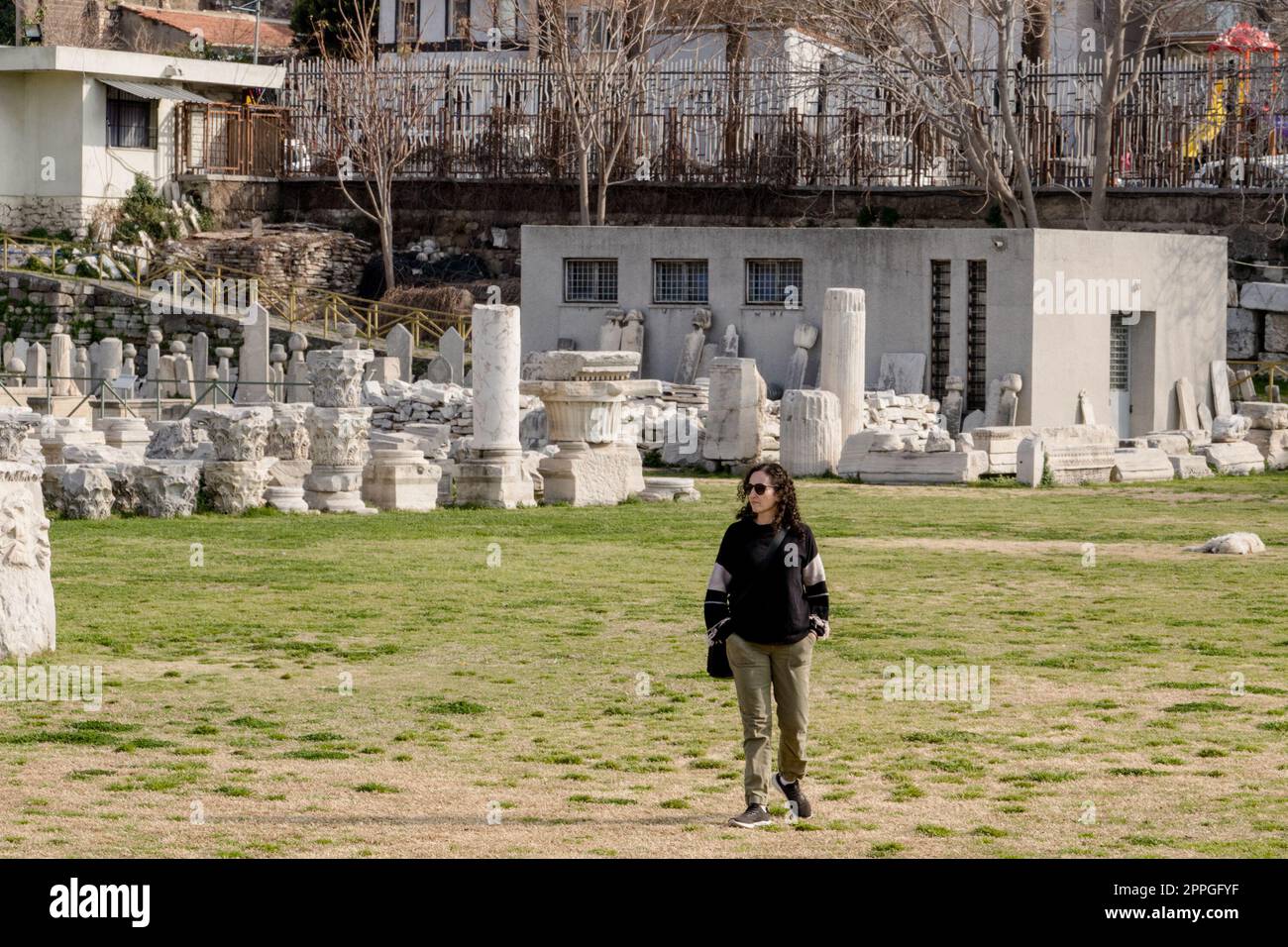 A tourist visits the Agora Ören Yeri in Izmir, Turkey, a magnificent ancient site that showcases the remnants of a once-great marketplace and cultural hub. Stock Photo