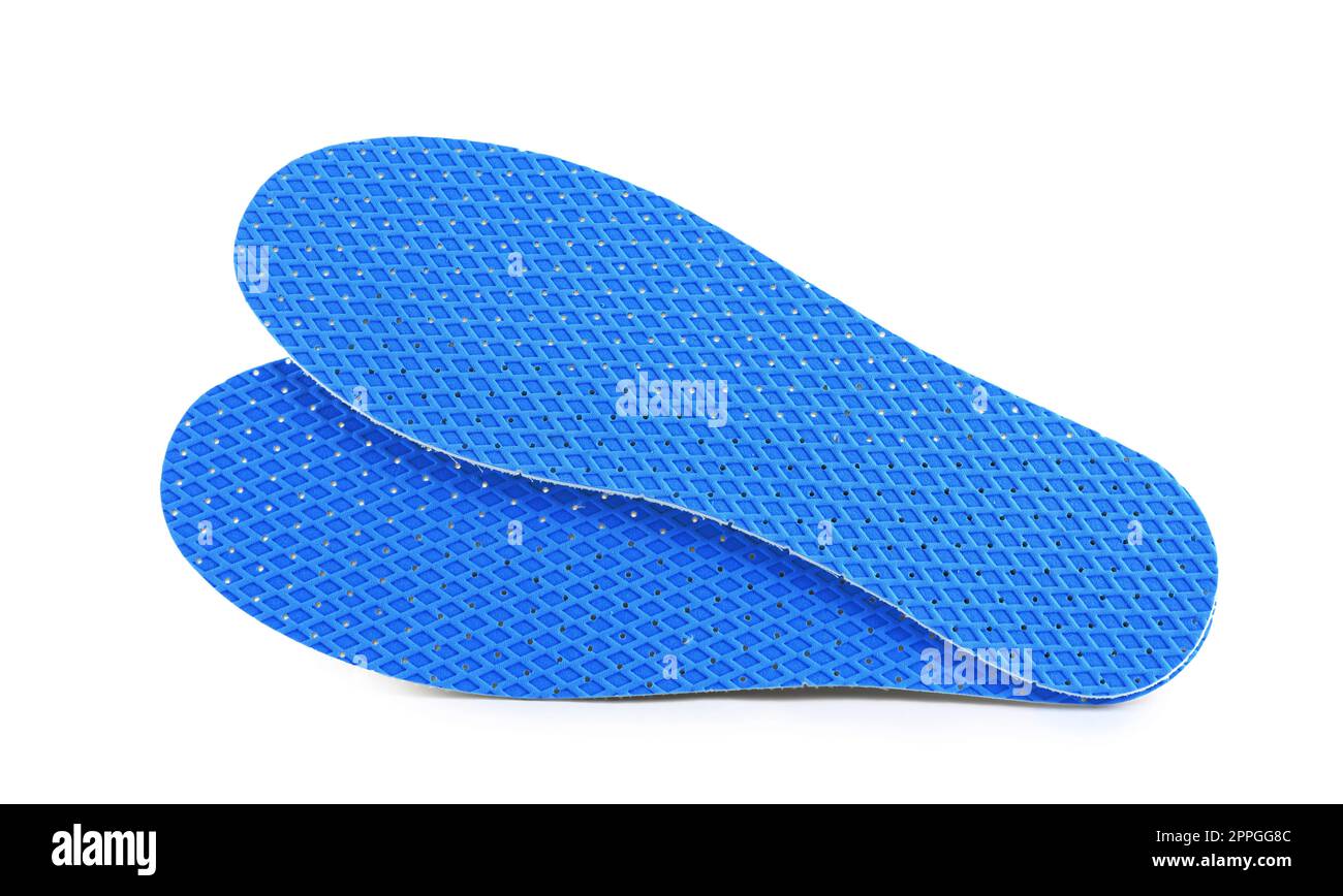 Light blue orthopedic insoles on white background Stock Photo Alamy