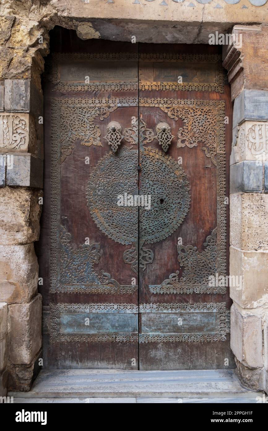 Wooden decorated copper plated door at Sultan Barquq mosque, Cairo, Egypt Stock Photo