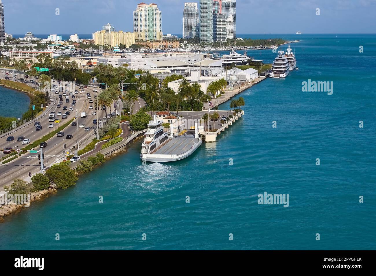 Ferry carrying vehicles to Fisher Island in Miami, Florida Stock Photo