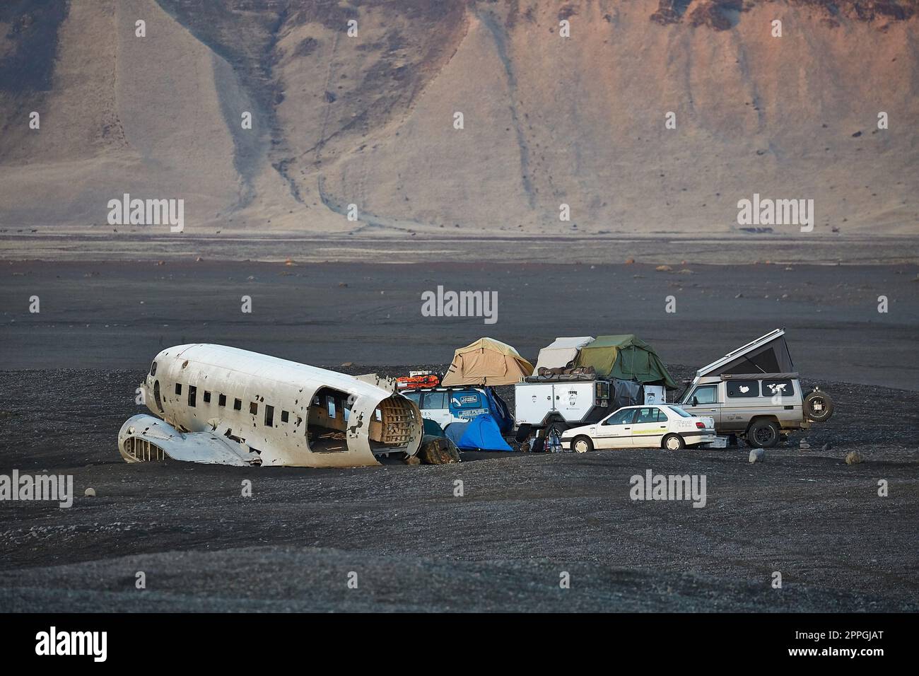 Plane wreck in Iceland, with expedition camping around Stock Photo