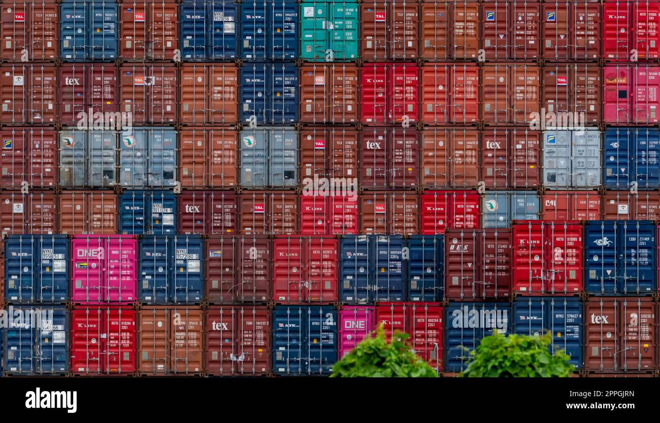 CHONBURI, THAILAND-AUGUST 20, 2022 : Stack of the logistic container. Cargo and shipping business. Container ship for export and import logistics. Logistic industry. Container for truck transport. Stock Photo