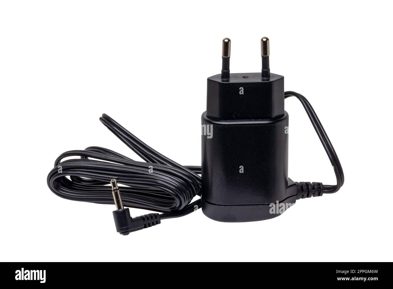 Closeup of a black AC to DC power adapter or charger for a rechargeable beard and hair clipper isolated on white background. Clipping path. Macro. Stock Photo