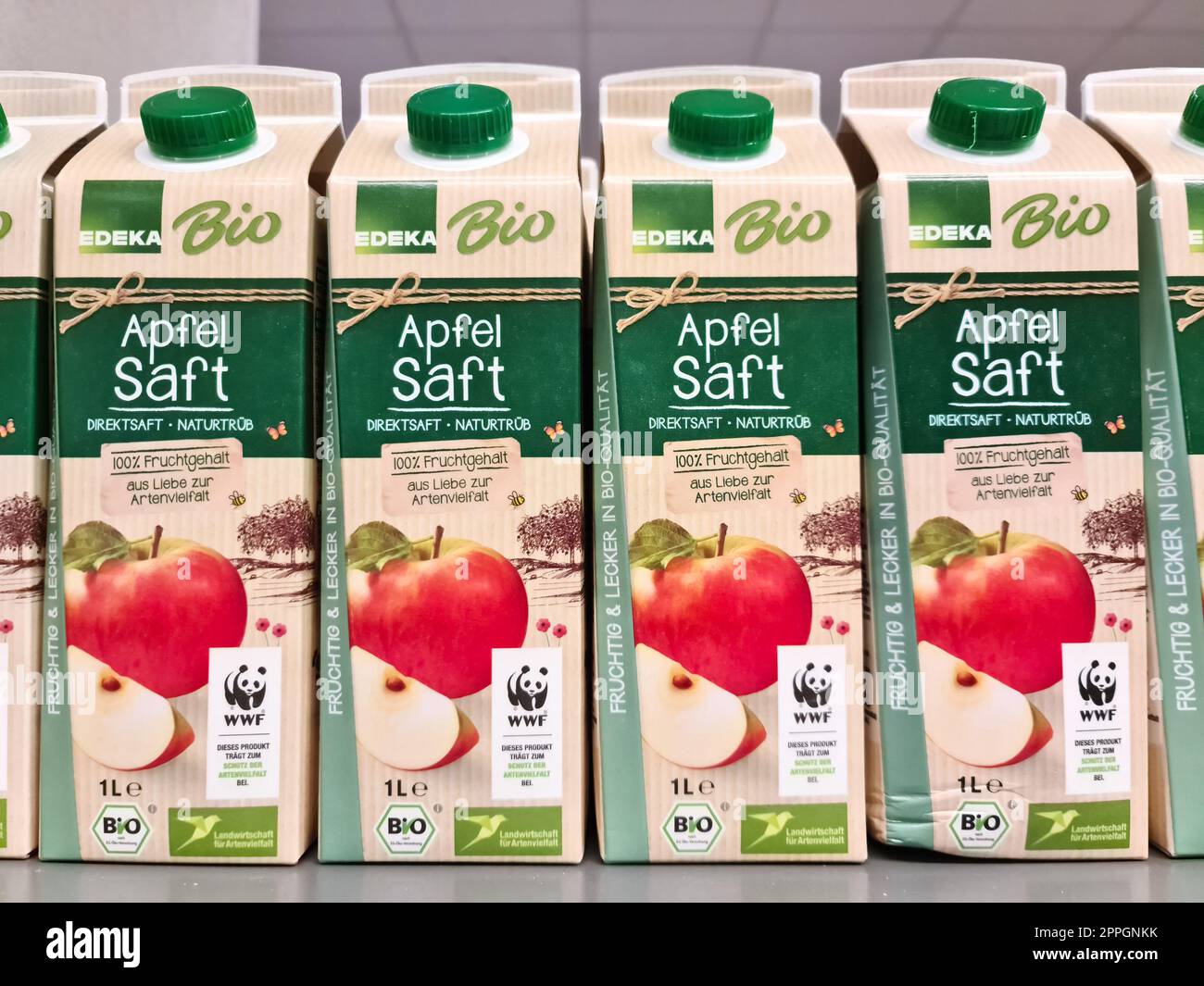 Hamburg, Germany - 03 September 2022: Apple juice tetrapacks of the Edeka private label on a supermarket shelf. Stock Photo