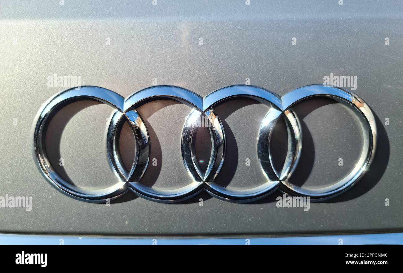 Hamburg, Germany - 03 September 2022: Close-up view of a shiny Audi logo on the front of a silver vehicle.. Stock Photo
