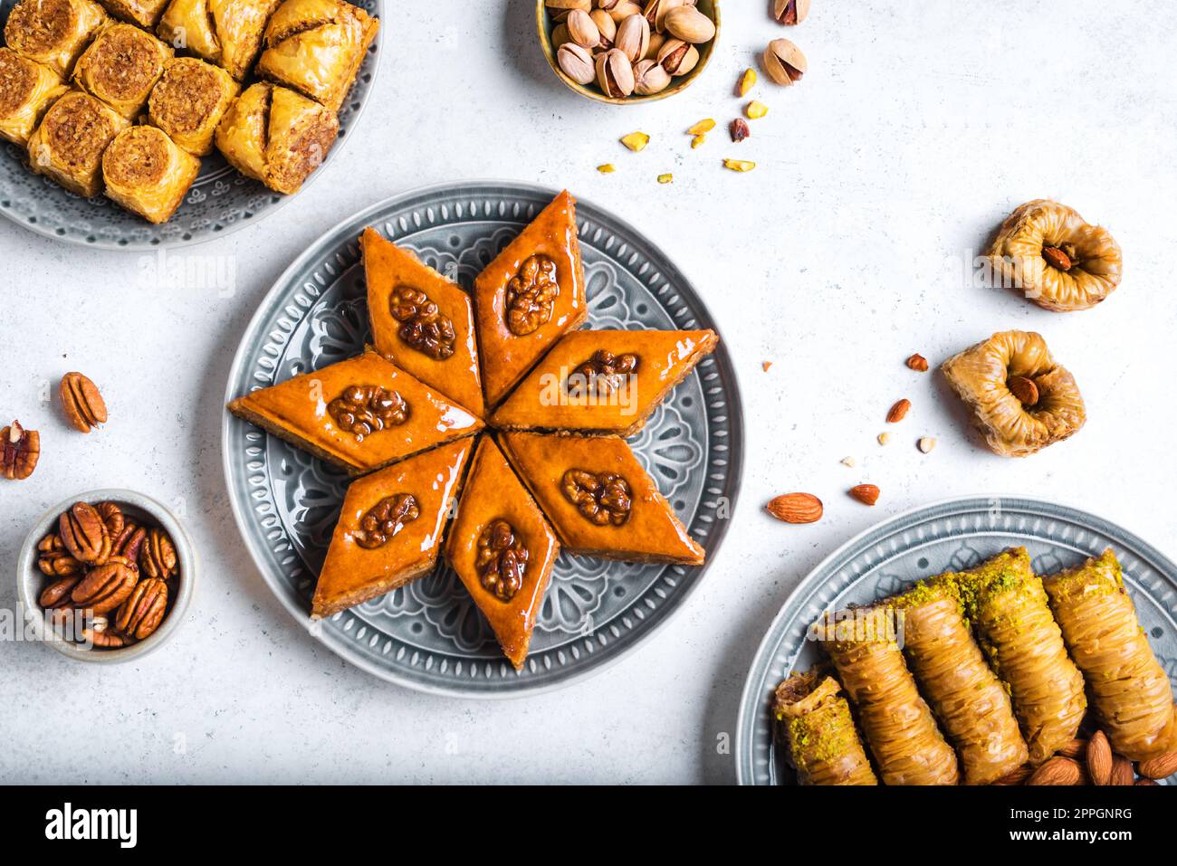 Arabian Baklava with nuts and honey on white background, top view. Ramadan dessert fresh