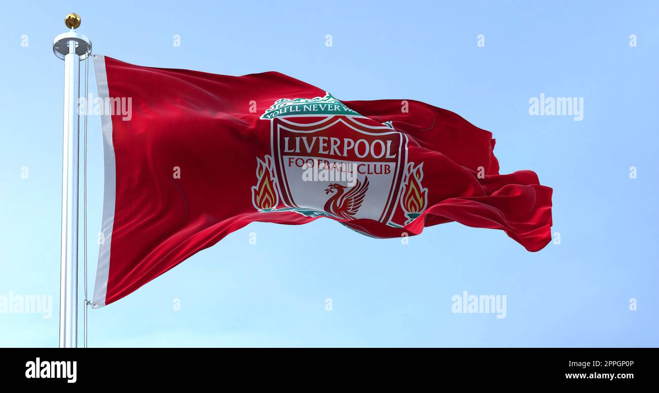 The flag of Liverpool Football Club waving in the wind on a clear day Stock Photo