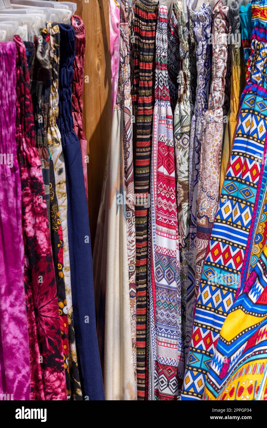 Natural, colorful clothes, oriental designs in shop in town on the Red