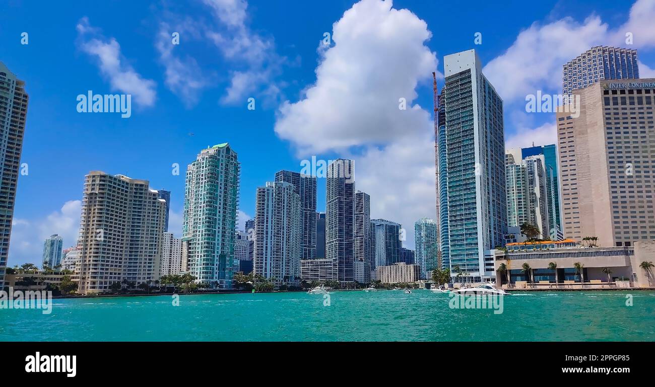 Miami, USA - April 23, 2022: Downtown Miami cityscape view with condos and office buildings against blue sky. Stock Photo
