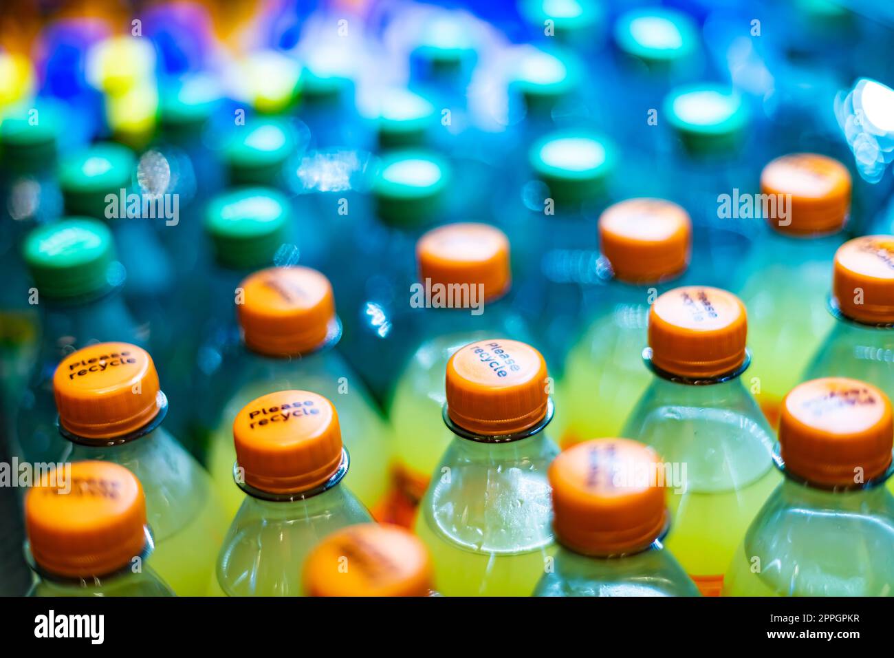 Bottles of drinks put out for sale in a commercial refrigerator Stock Photo