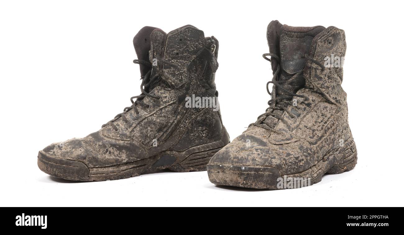 Black shoes, covered in mud, isolated on white Stock Photo - Alamy