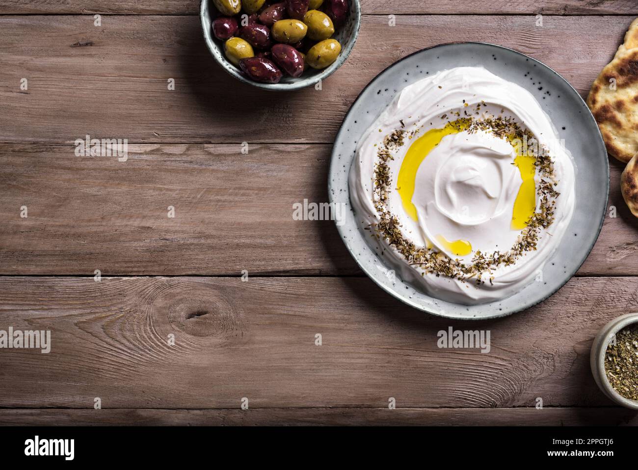 Labneh yogurt cream cheese with olive oil and zaatar, copy space