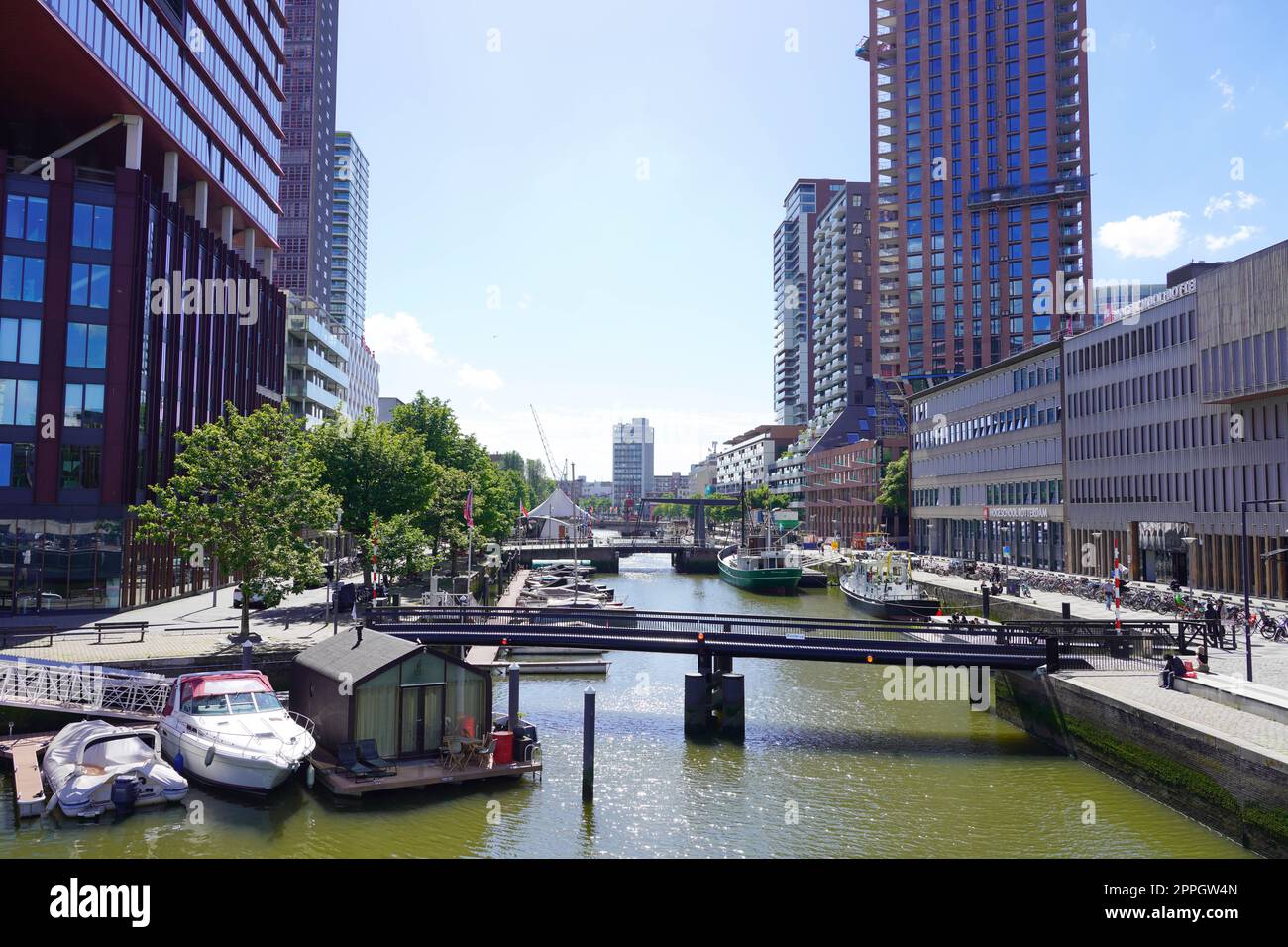 ROTTERDAM, NETHERLANDS - JUNE 9, 2022: Rotterdam cityscape with canal on sunny day, Netherlands Stock Photo