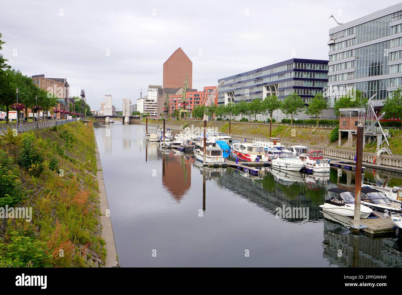 DUISBURG, GERMANY - JUNE 10, 2022: Inner harbor of Duisburg with the buildings of Mitsubishi, Hitachi, TK Gesundheit and the State Archives of North Rhine-Westphalia Duisburg, Germany Stock Photo