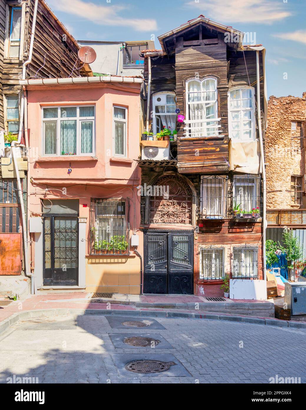 Old traditional wooden and stone houses in old Balat district, on a summer day, Istanbul, Turkey Stock Photo