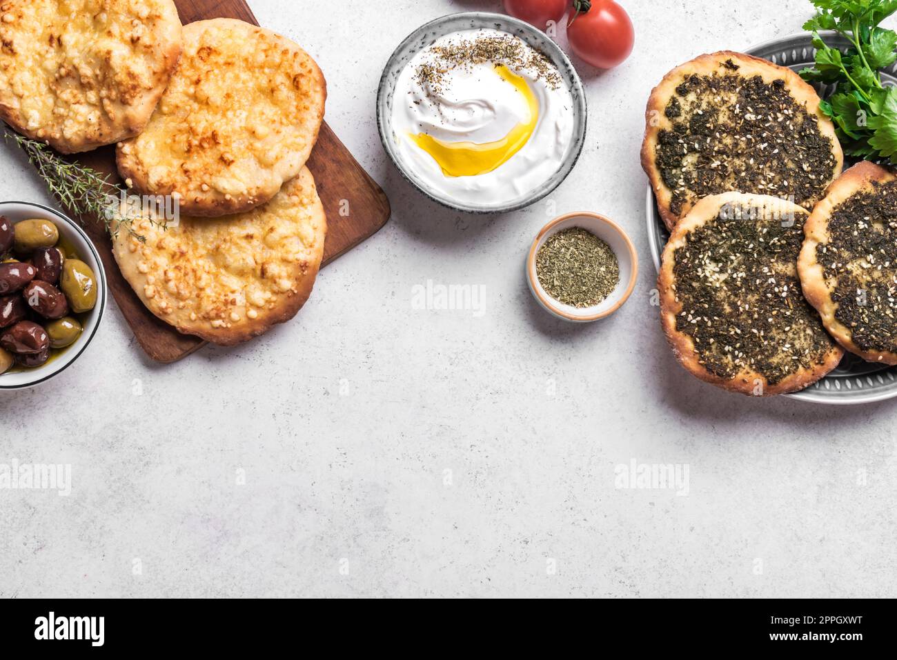 Arabic breakfast, labneh yogurt, manakeesh or pita bread with cheese