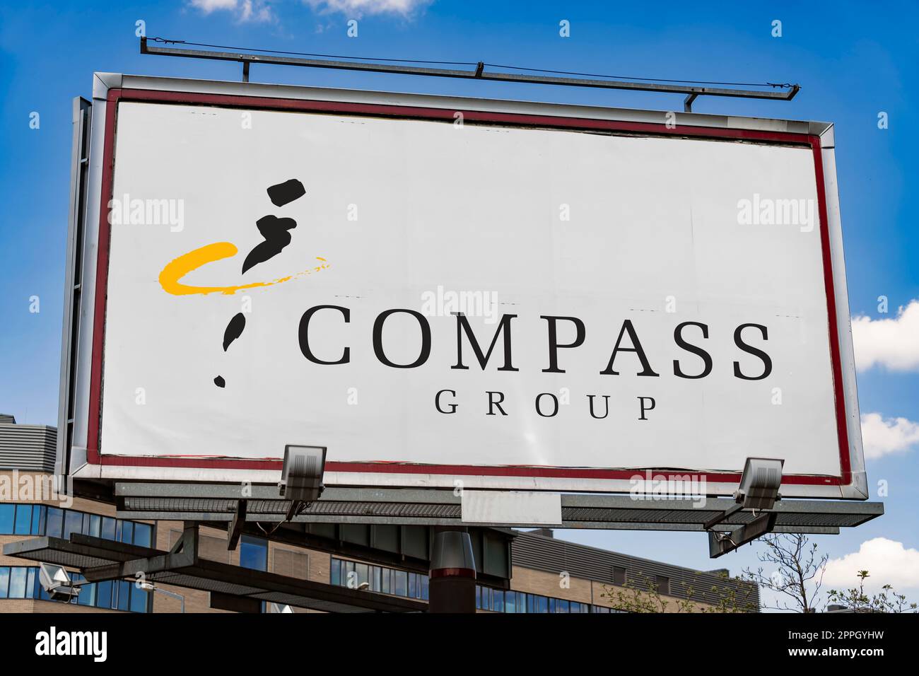 Advertisement billboard displaying logo of Compass Group Stock Photo