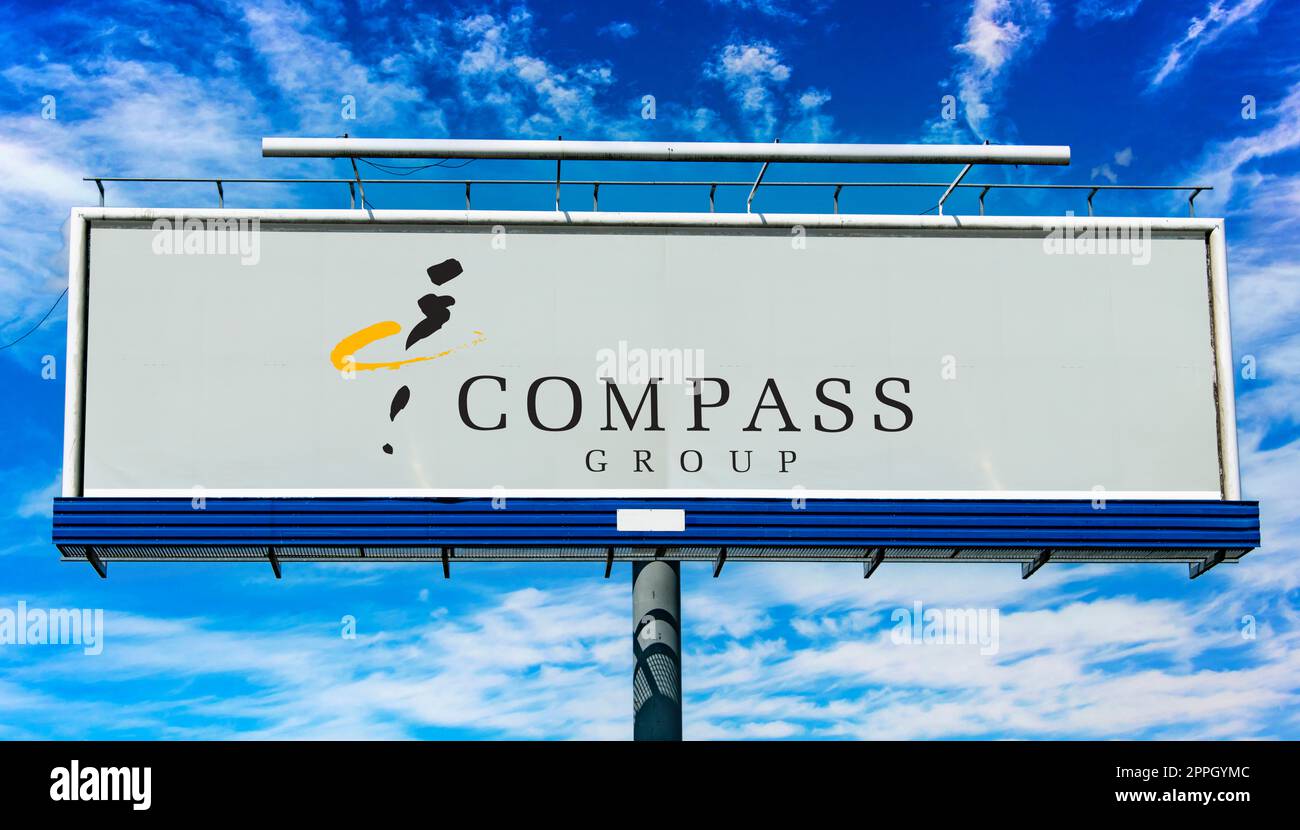 Advertisement billboard displaying logo of Compass Group Stock Photo