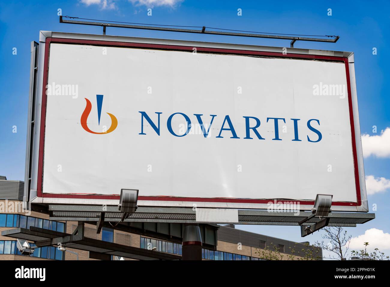 Advertisement billboard displaying logo of Novartis Stock Photo