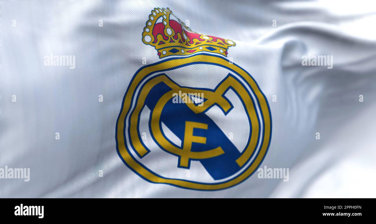 The flag of Real Madrid Club de Futbol waving in the wind on a clear day Stock Photo
