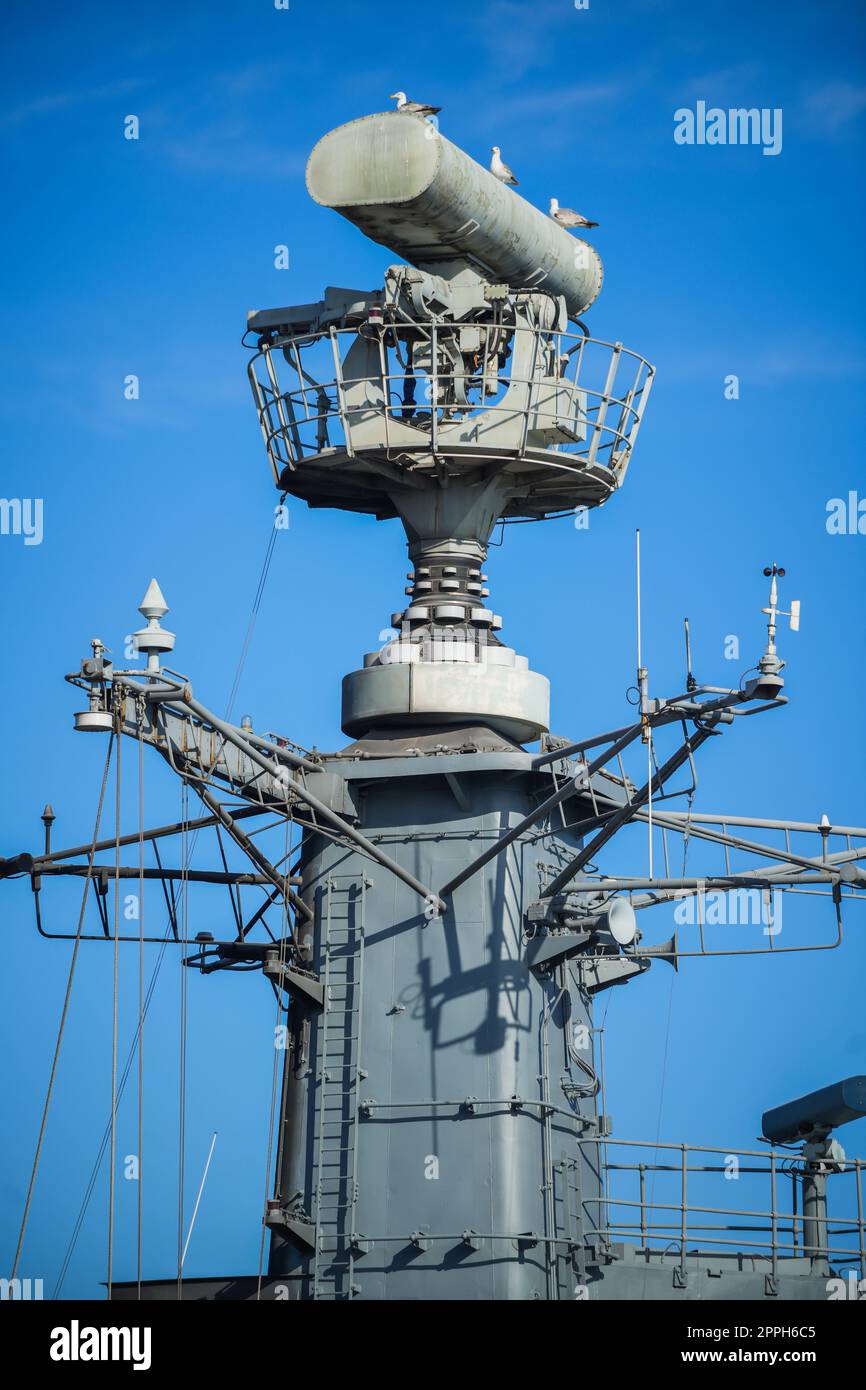 Image of a military radar air surveillance on navy ship tower Stock