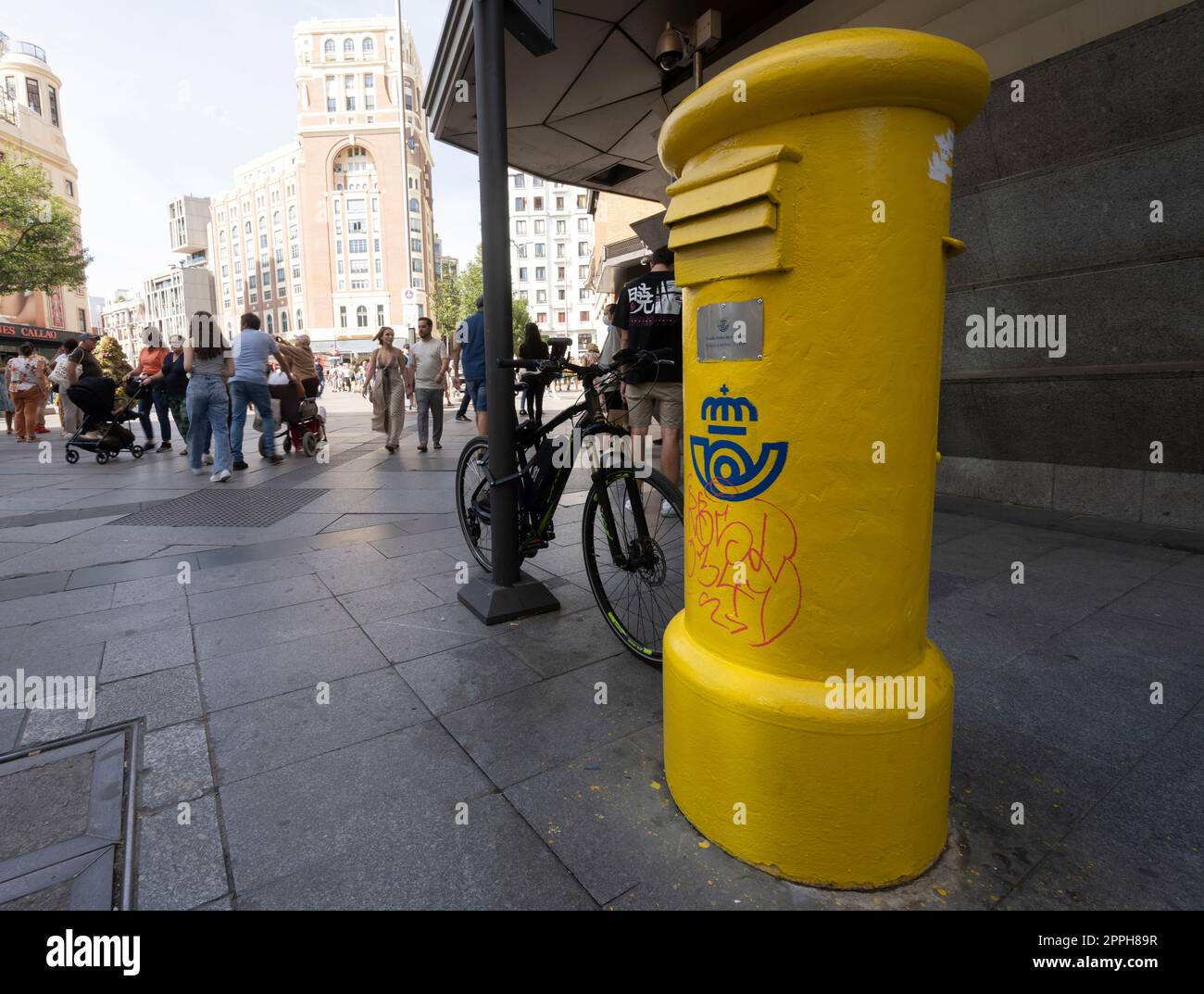 a typical yellow letterbox in Madrid, Spain Stock Photo Alamy