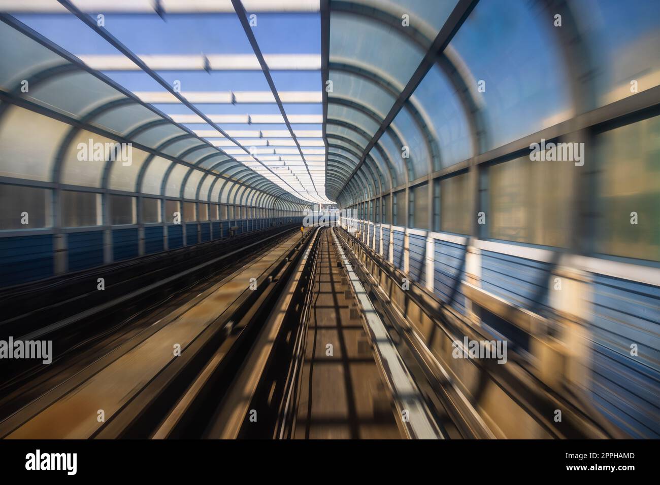 Motion blur of train moving inside tunnel Stock Photo