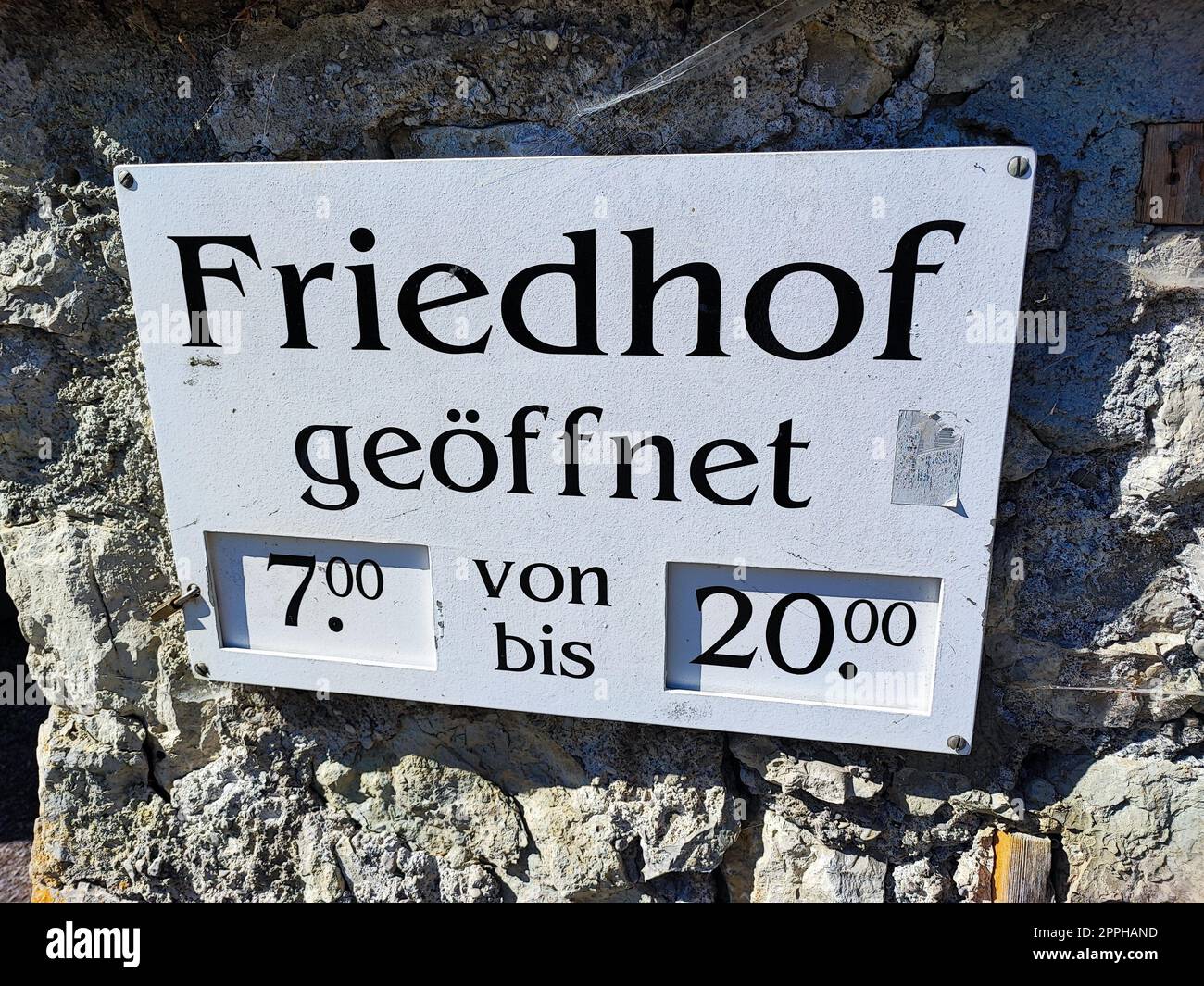 sign cemetery opening hours Stock Photo - Alamy
