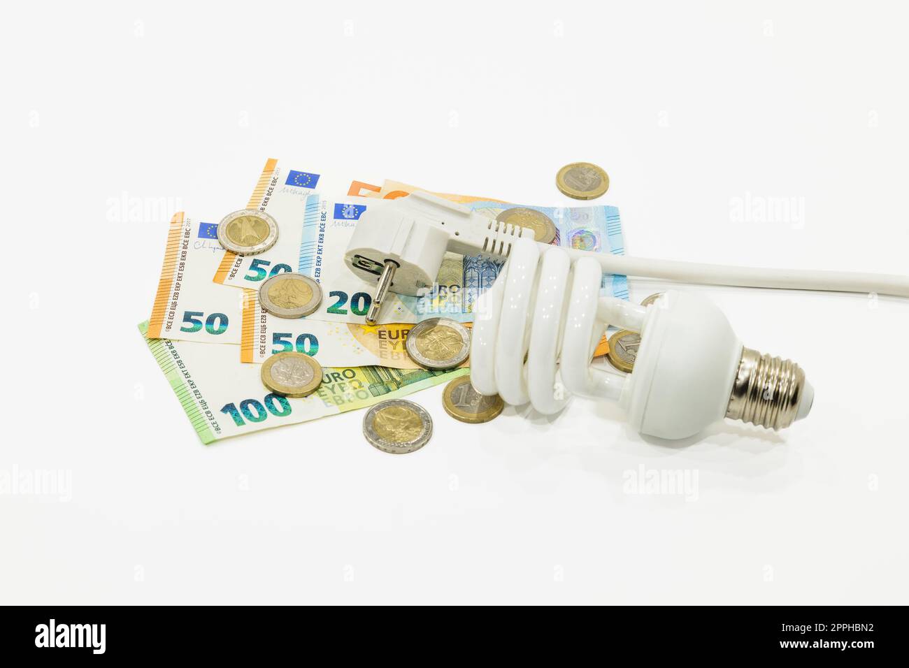 Light bulb, electric plug, and the euro money banknotes. Concept of