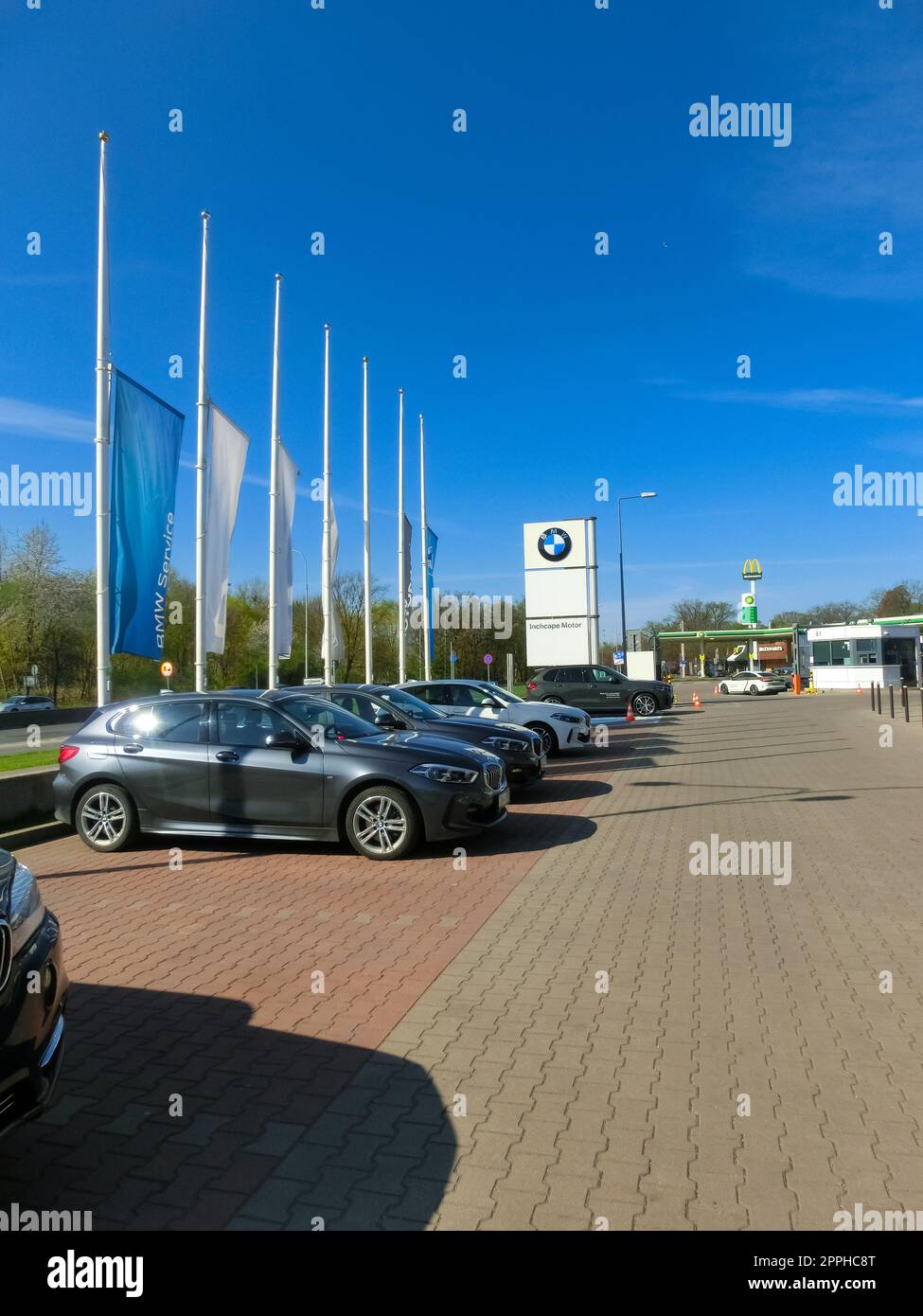 BMW car dealership with cars parked on forecourt. Stock Photo
