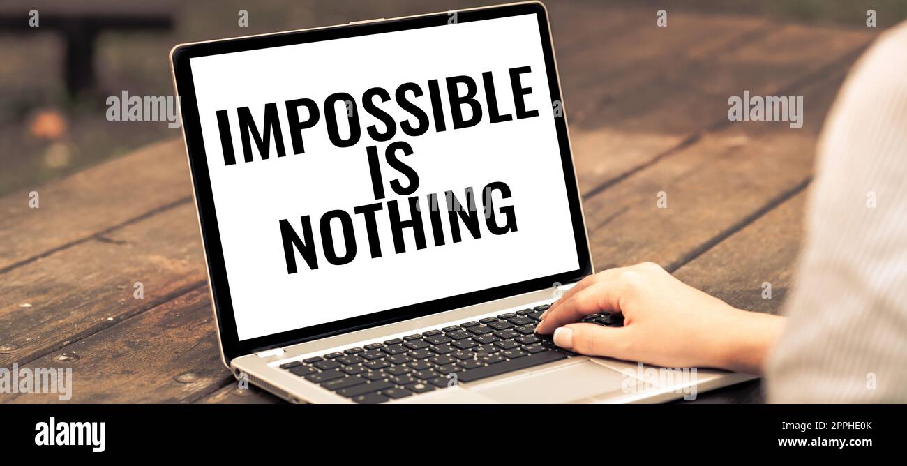 Sign displaying Impossible Is Nothing. Business concept Motivated to achieve something despite challenges Stock Photo