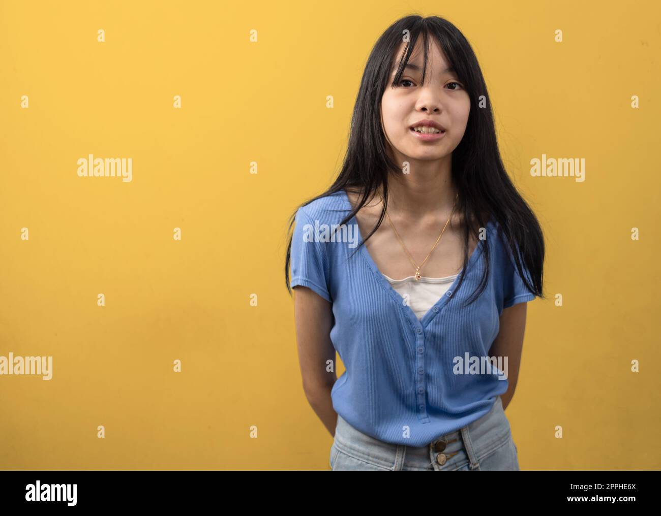 asian girl smiling. lifestyle beauty and fashion on yellow background.copy space. Stock Photo