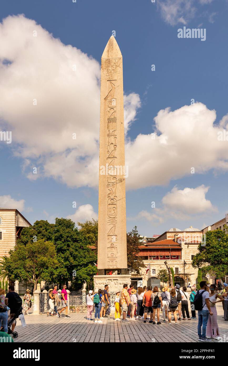 Tourists visiting ancient Egyptian Obelisk of Pharaoh Thutmose III, or Sultanahmet Square