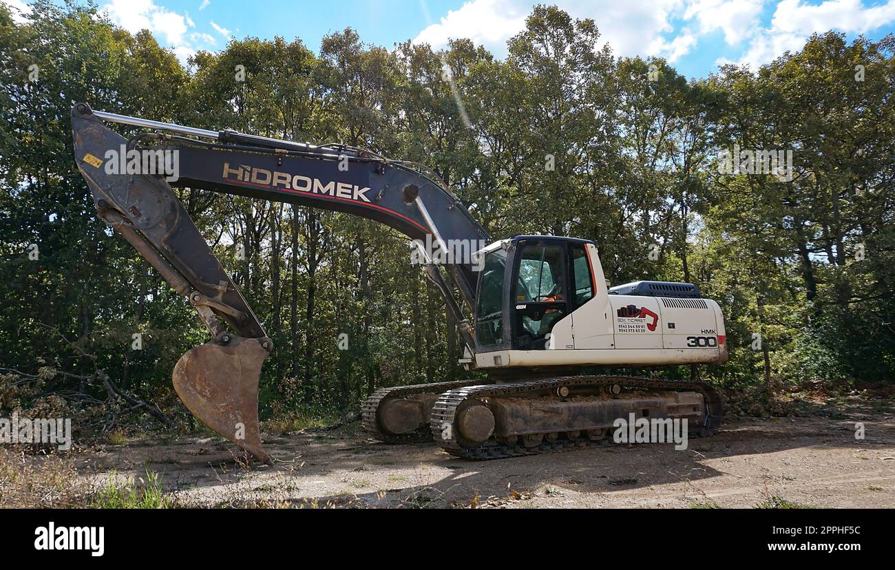 Chorlu, Turkey - September 24, 2022: Turkish crawler excavator Hidromek parked on a road near Chorlu Stock Photo