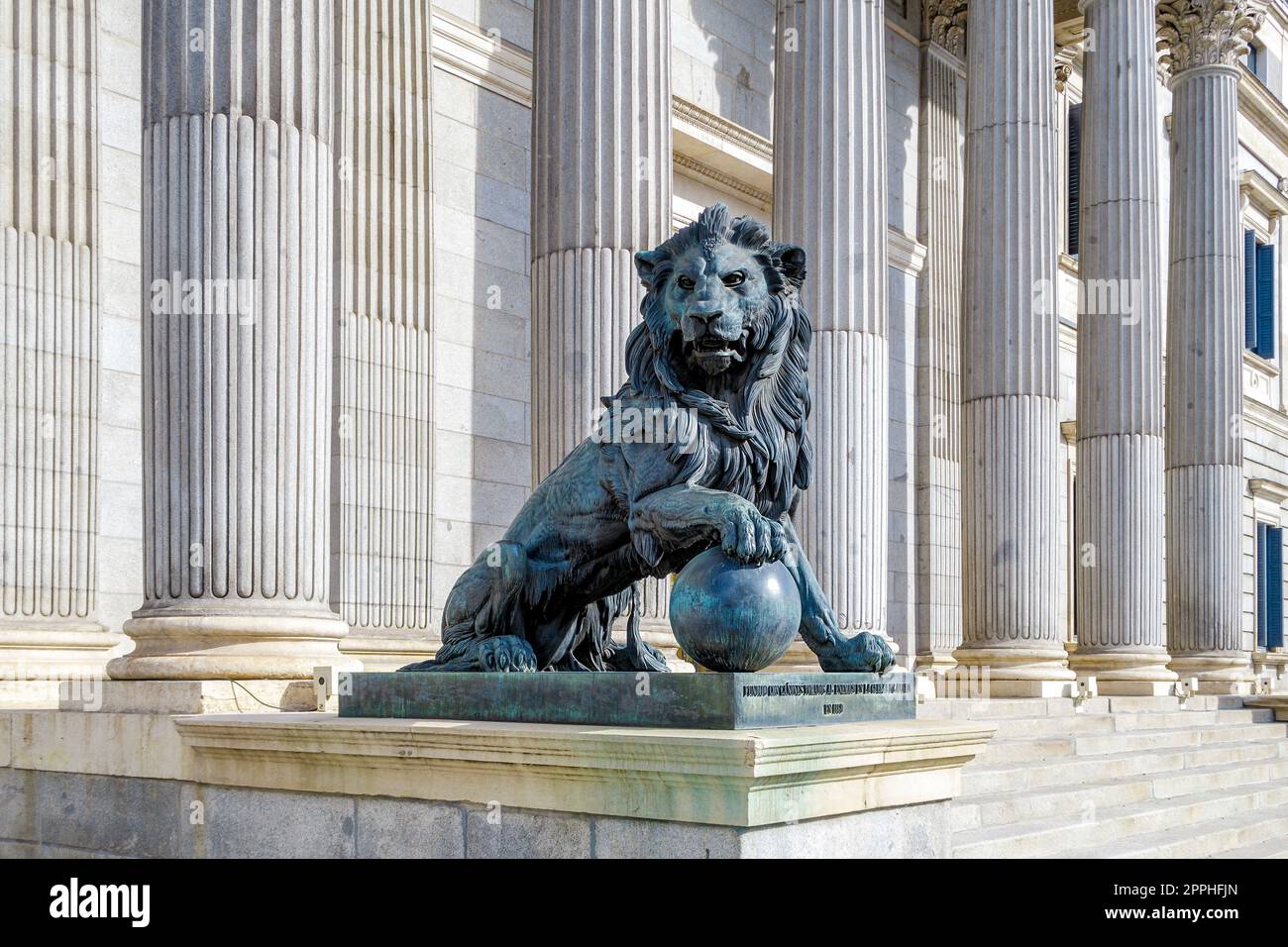 Parliament facade columns and lion in Madrid, Spain. Congreso diputados Stock Photo