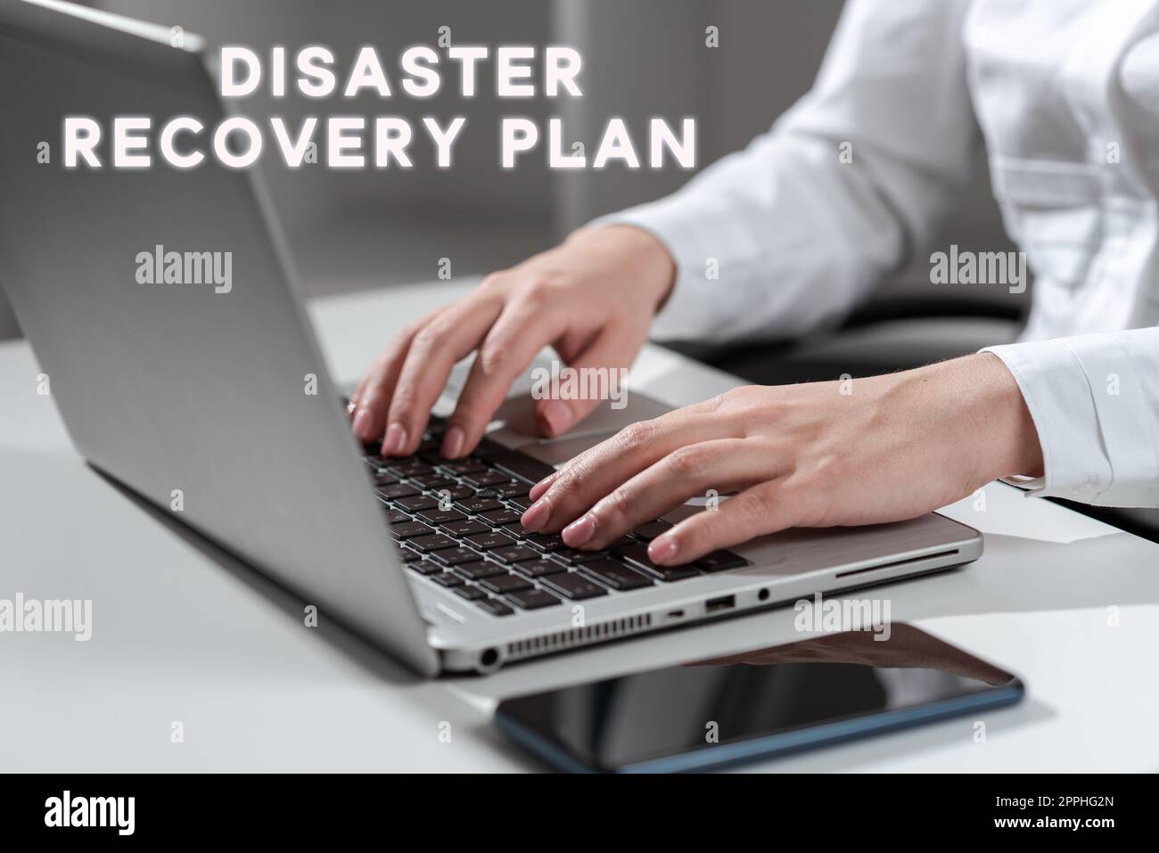 Hand writing sign Disaster Recovery Plan. Business concept having backup measures against dangerous situation Stock Photo