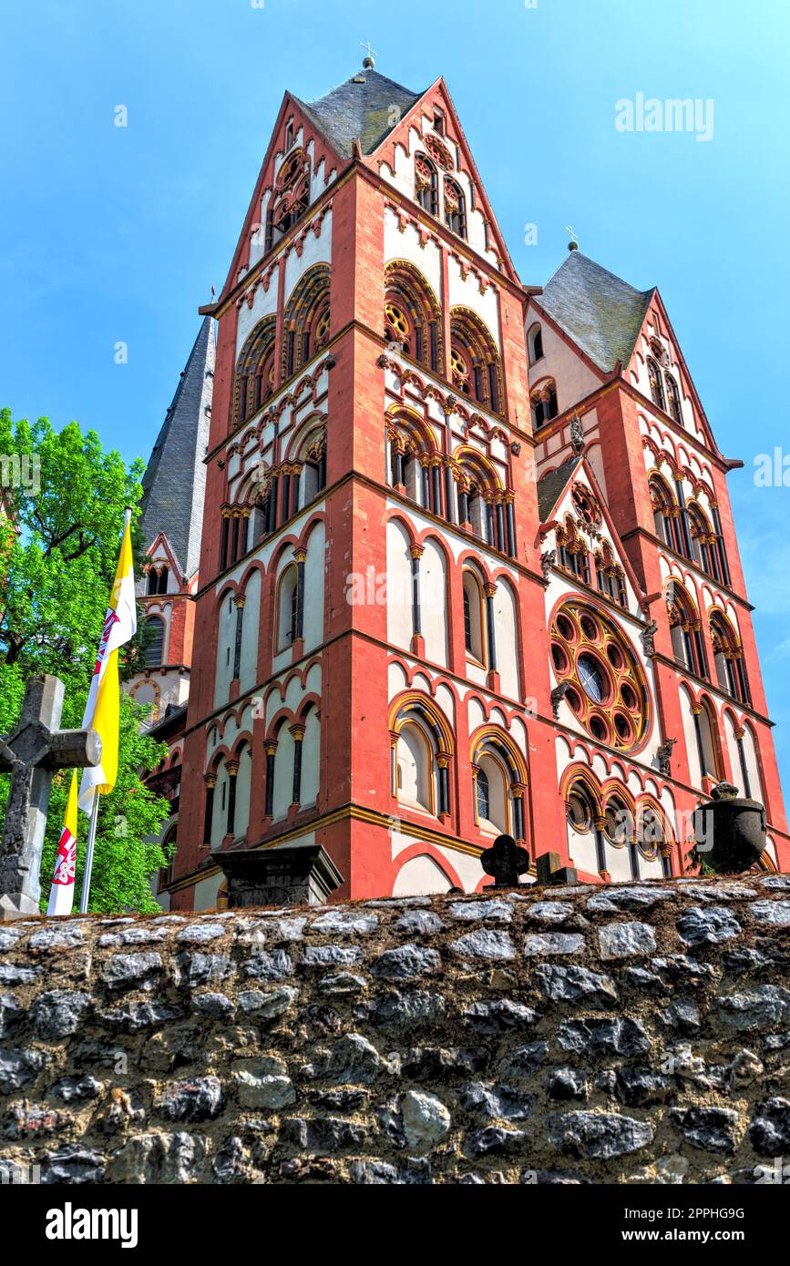 The red and white exterior facade of Limburg Cathedral with its two main towers Stock Photo