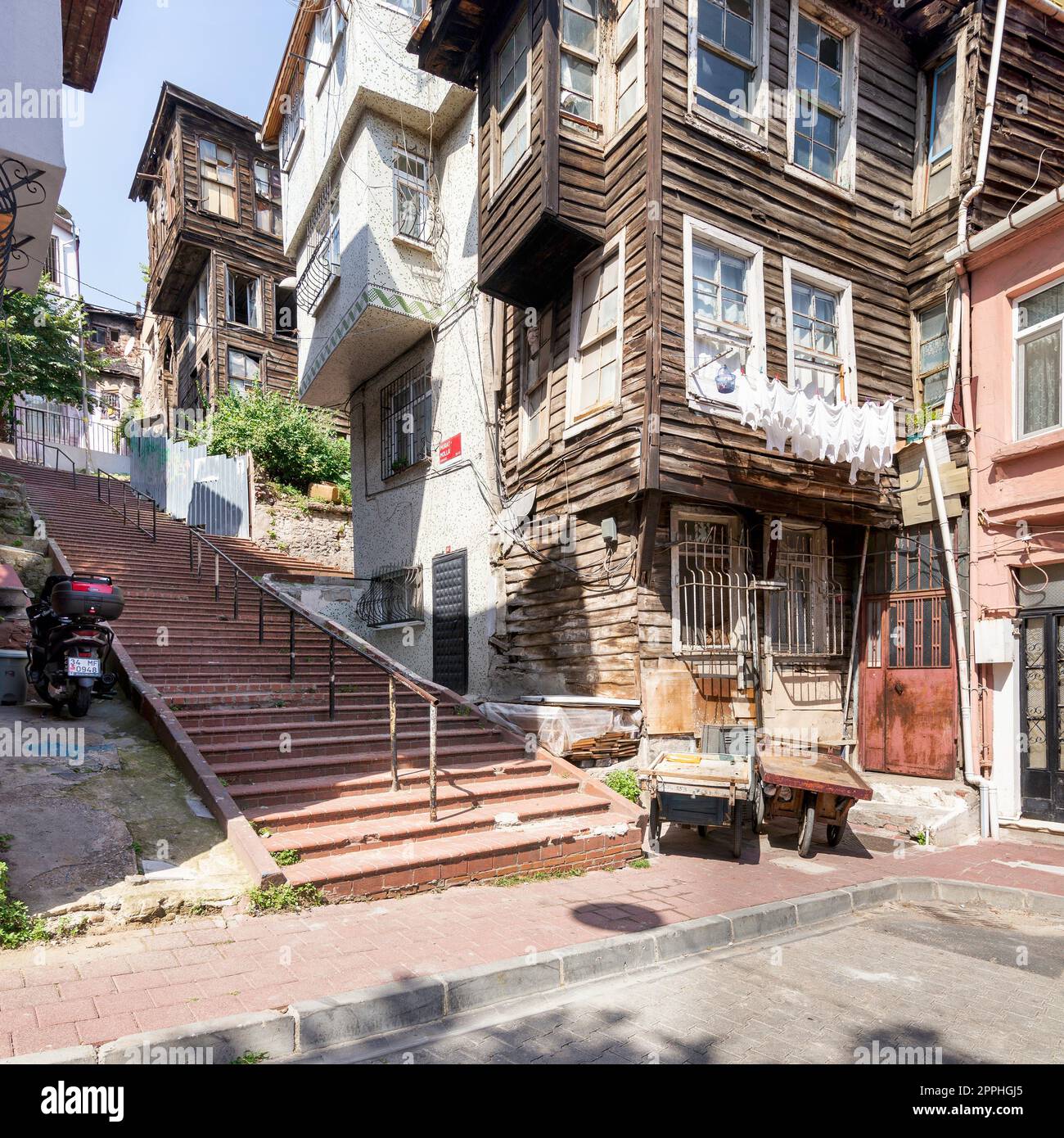 Old traditional wooden and stone houses, and stone staircase, in old Balat district, on a summer day, Istanbul, Turkey Stock Photo